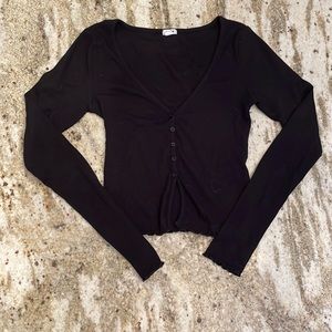 Black long sleeve from garage with ruched sleeves and waist.